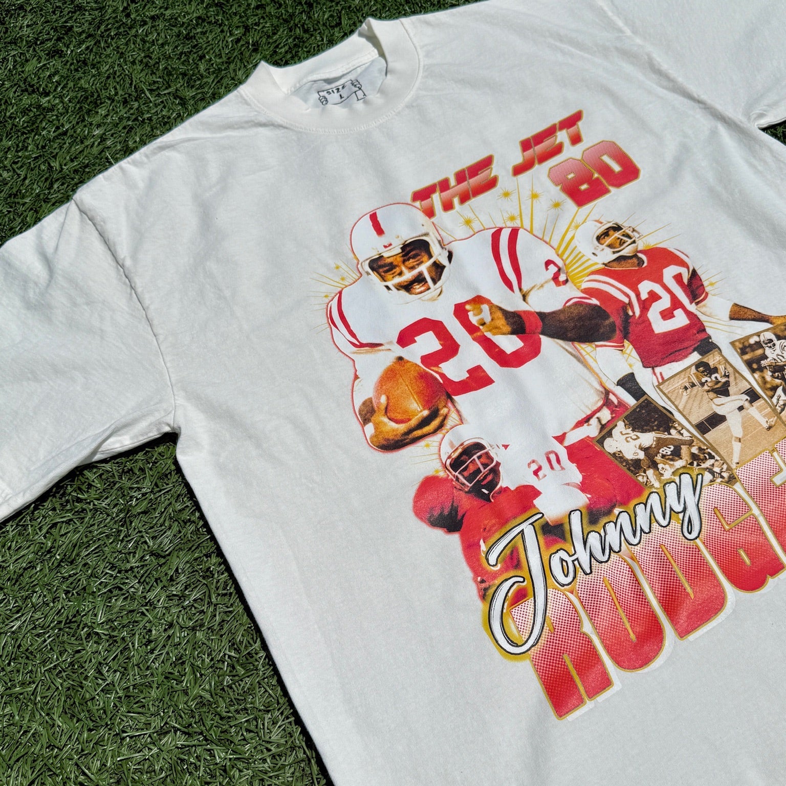 White sweatshirt with a graphic of a football player and text on a grass background