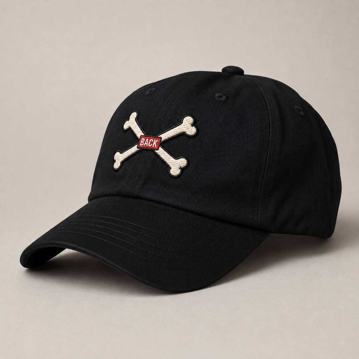 Black Bones Dad Hat angled front view with crossed-bones embroidery