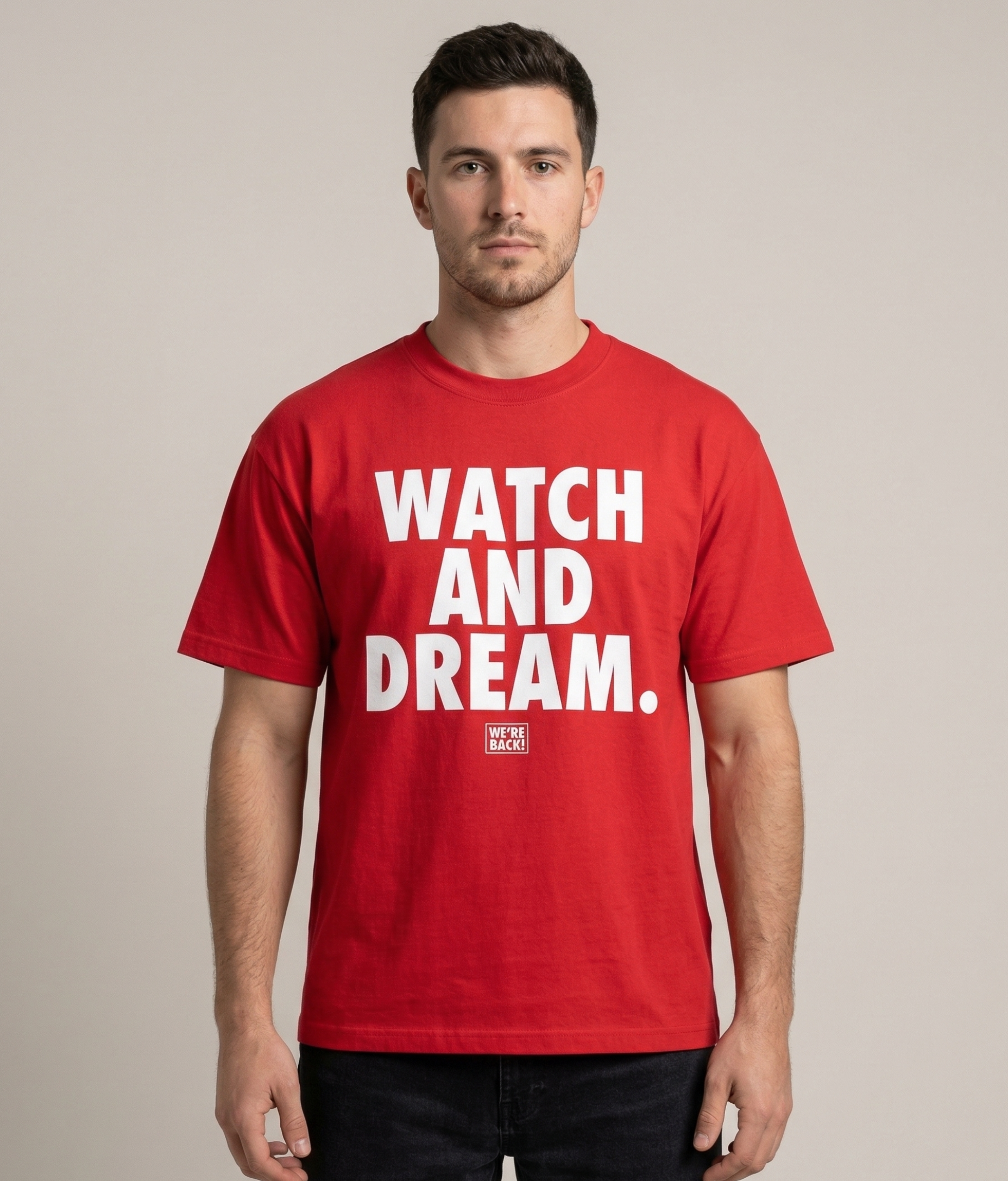 Man wearing a red t-shirt with 'WATCH AND DREAM.' text on a beige background