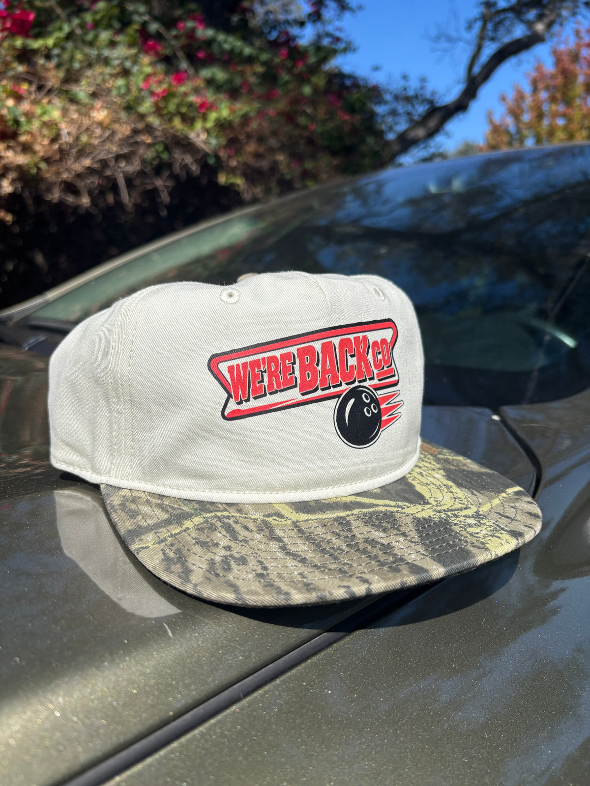 Original sample photo: WBC Bowling Cap with natural crown, tree camo brim and WBC bowling logo