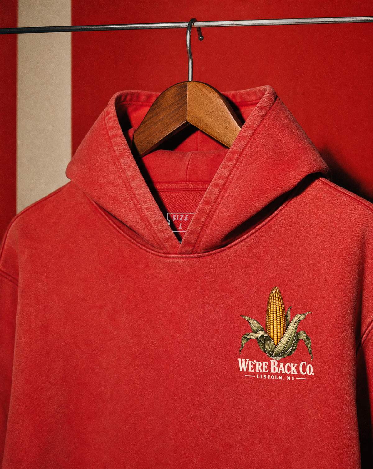 Front of the vintage red Don't Panic Hoodie with the small corn chest graphic.