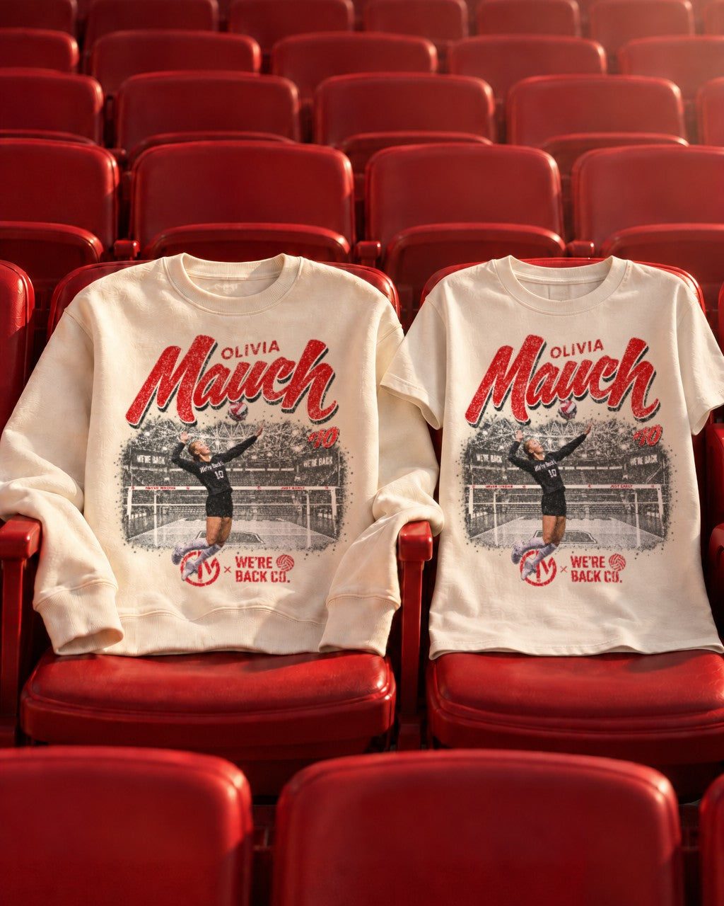 The cream crewneck and faded cream tee draped over red arena seats.
