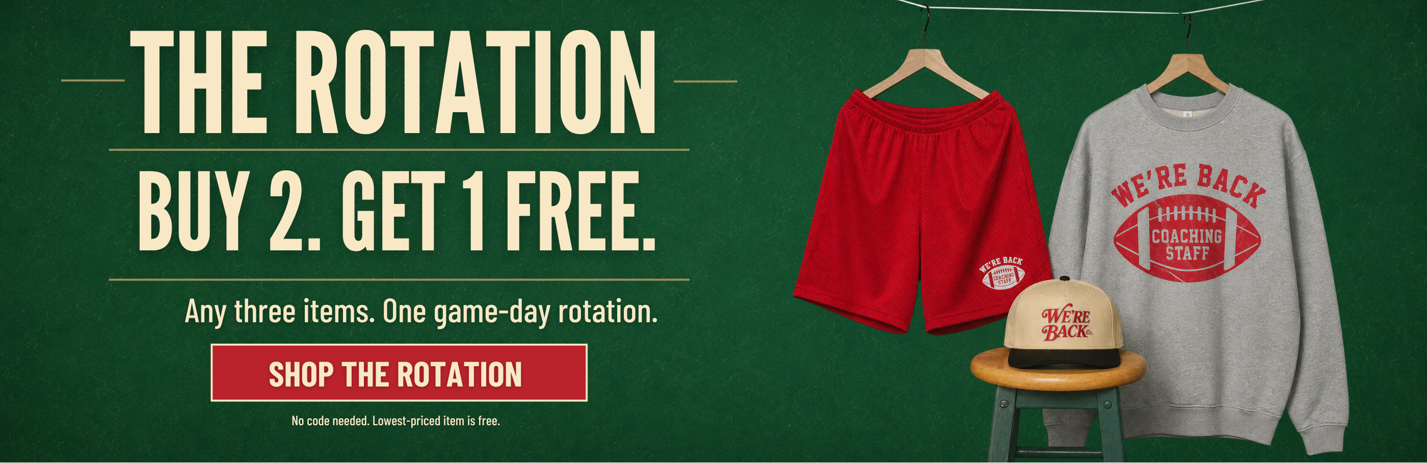 Promotional banner for 'The Rotation' buy 2 get 1 free offer by We're Back Co., showing a red athletic shorts set, a gray graphic sweatshirt, and a baseball cap on hangers against a dark green chalkboard-style background.