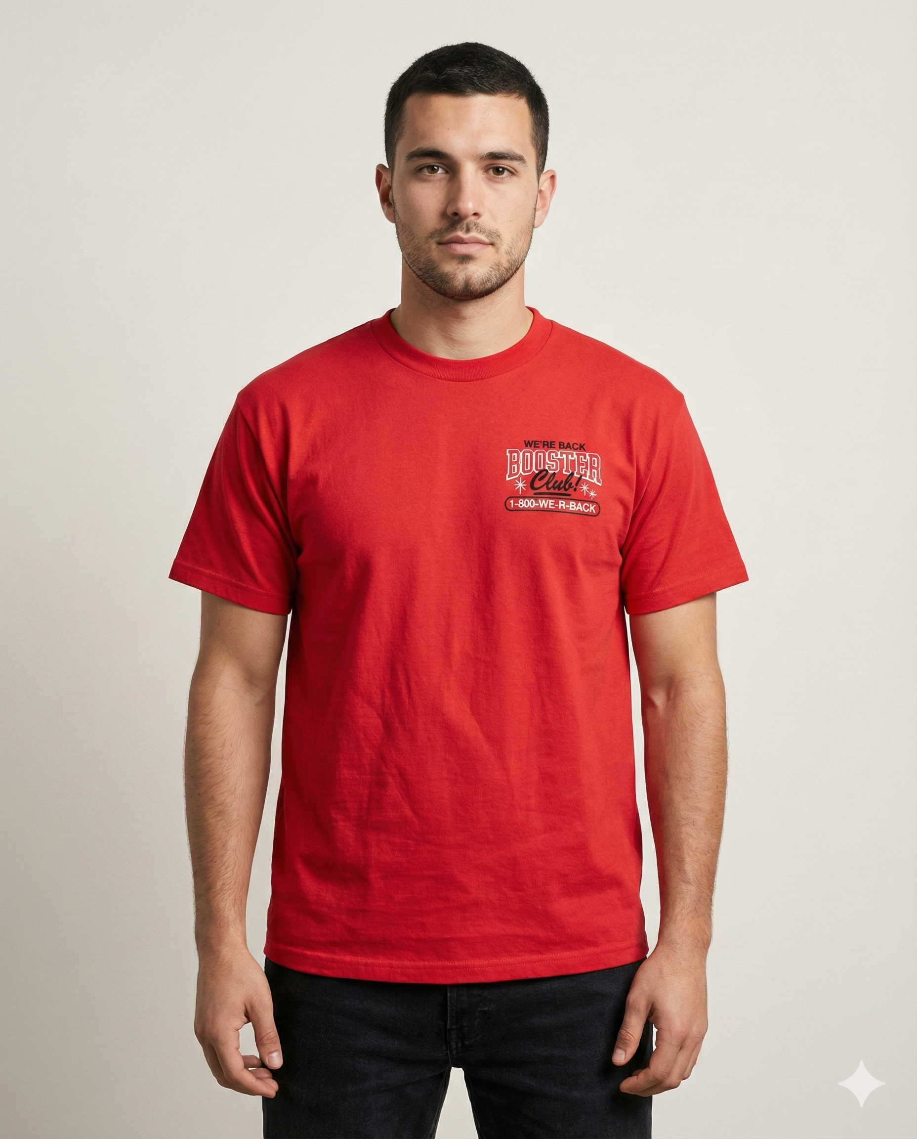 Man wearing a red t-shirt with a logo on a plain background