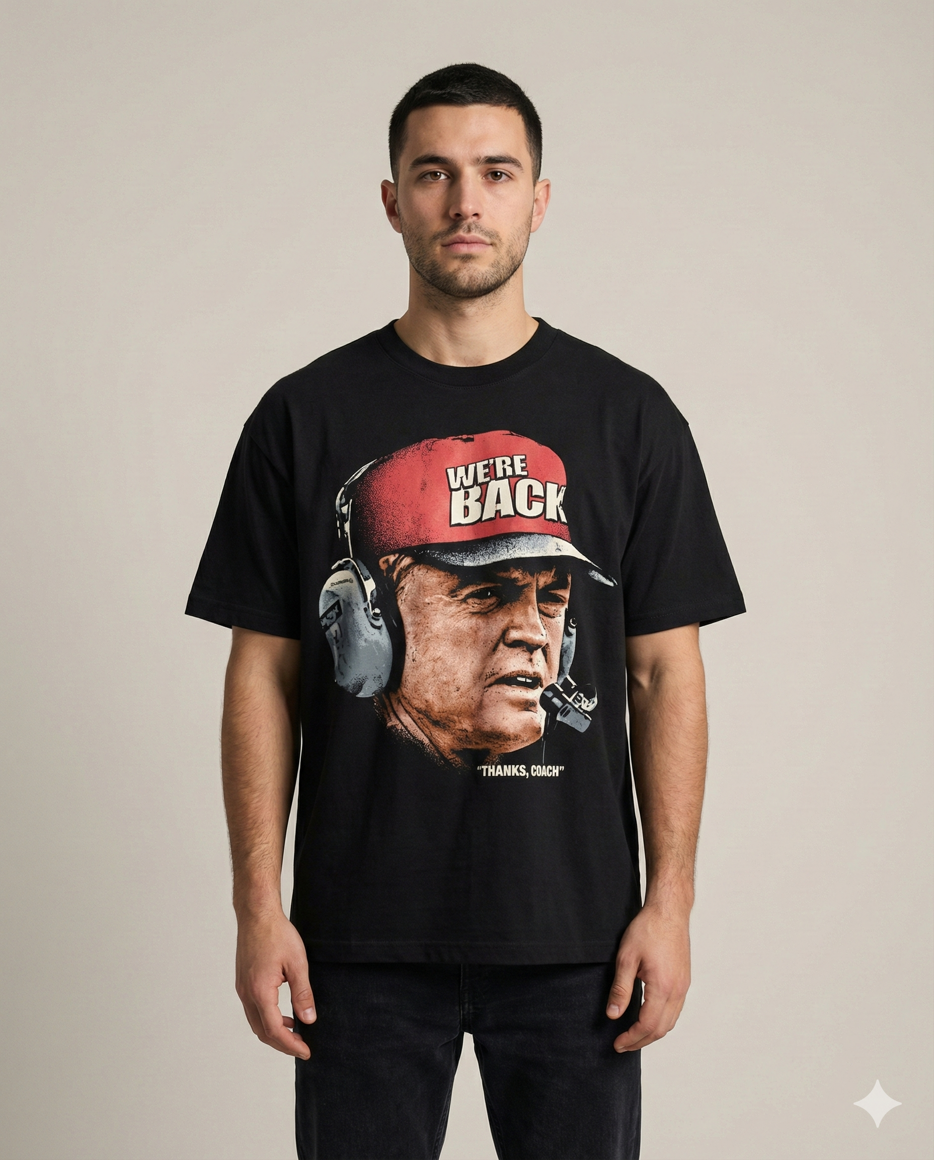 Man wearing a black t-shirt with a graphic design on a beige background