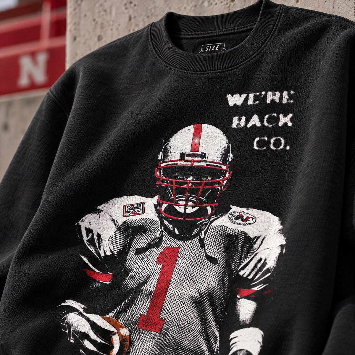 Low Profile football graphic detail on the black crewneck.