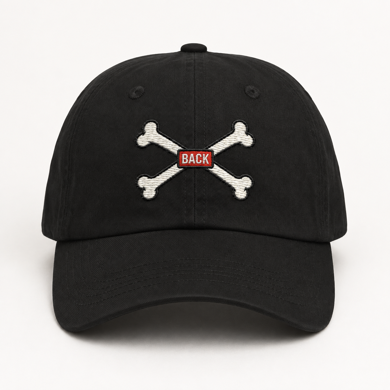 Black Bones Dad Hat with crossed-bones embroidery and red BACK tab