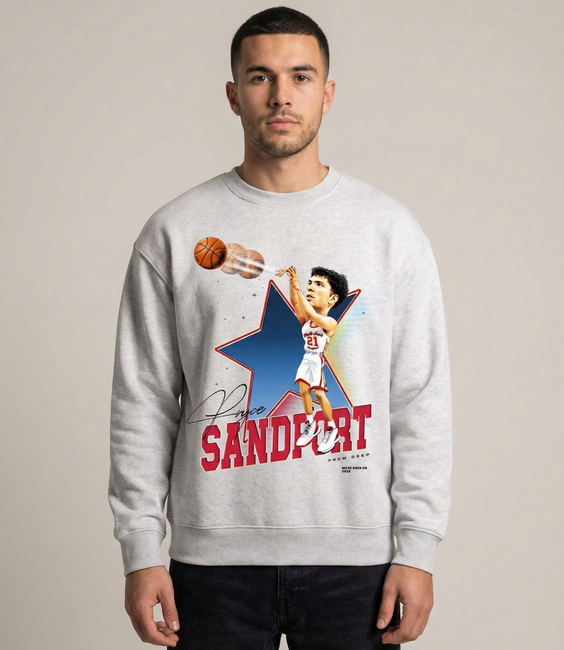 Person wearing a gray sweatshirt with a graphic design and text on a plain background